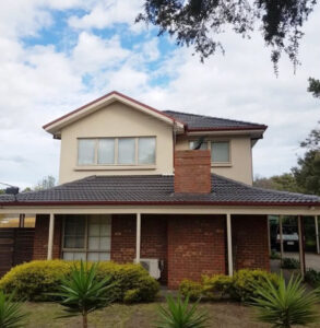 Roof painters applying weatherproof coating – roof painting and sealing
